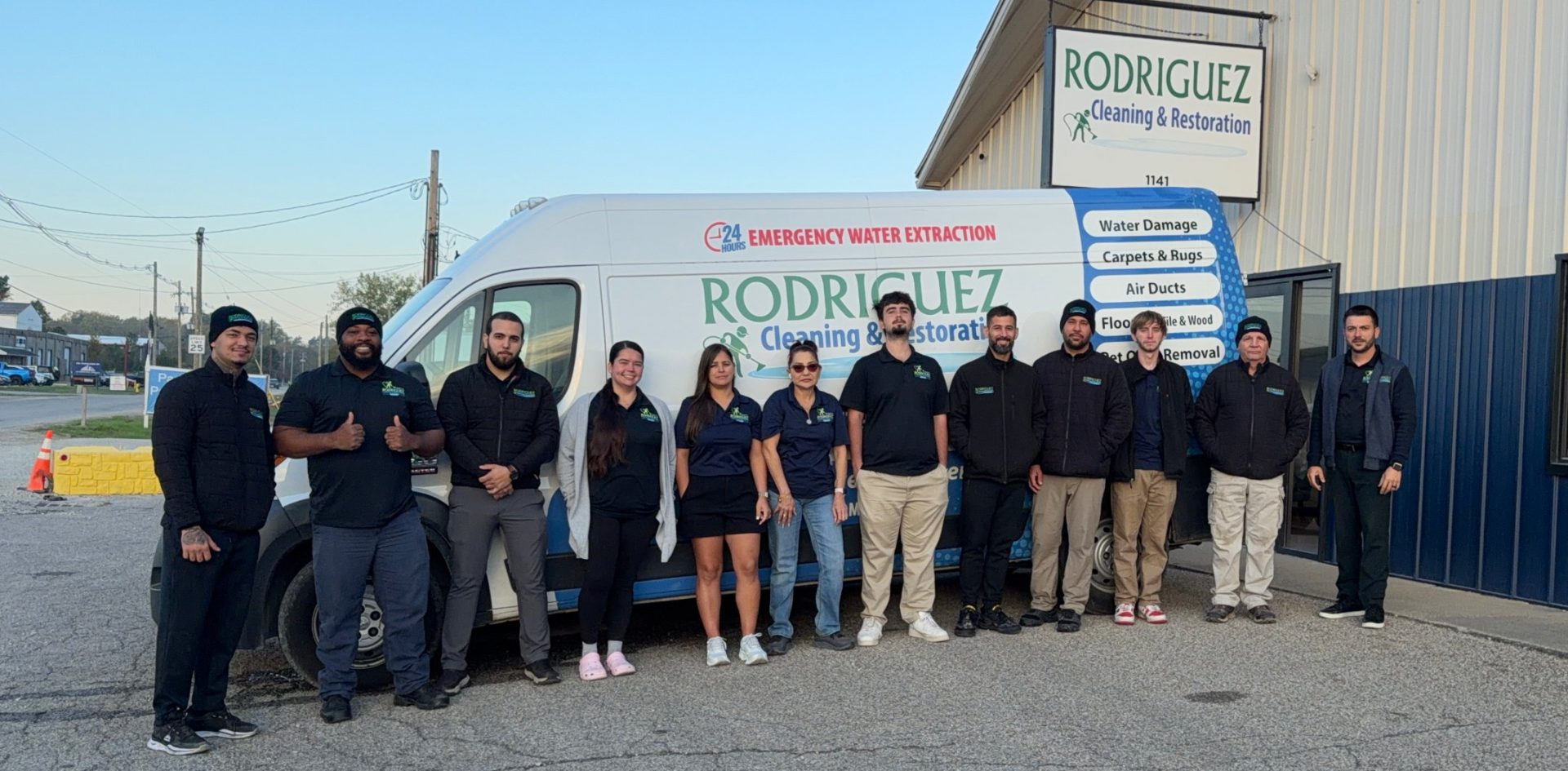 Rodriguez Cleaning and Restoration team in front of the company van and office in Louisville, KY